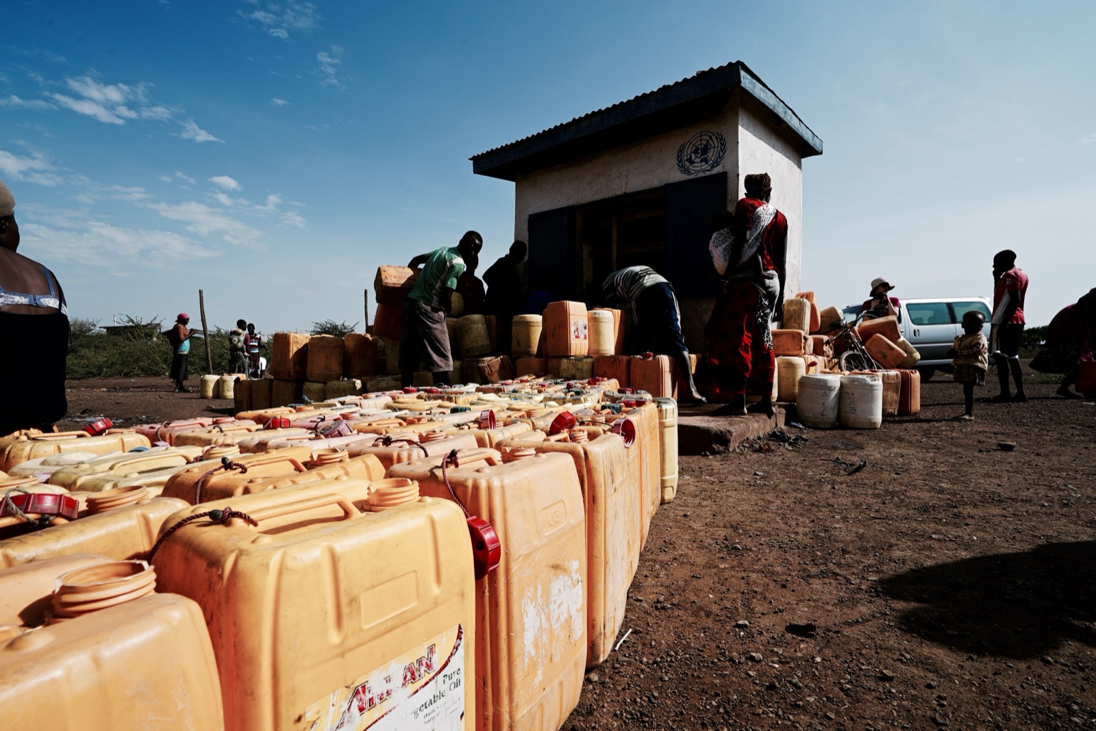 Rows of yellow jerry cans at a UN water point